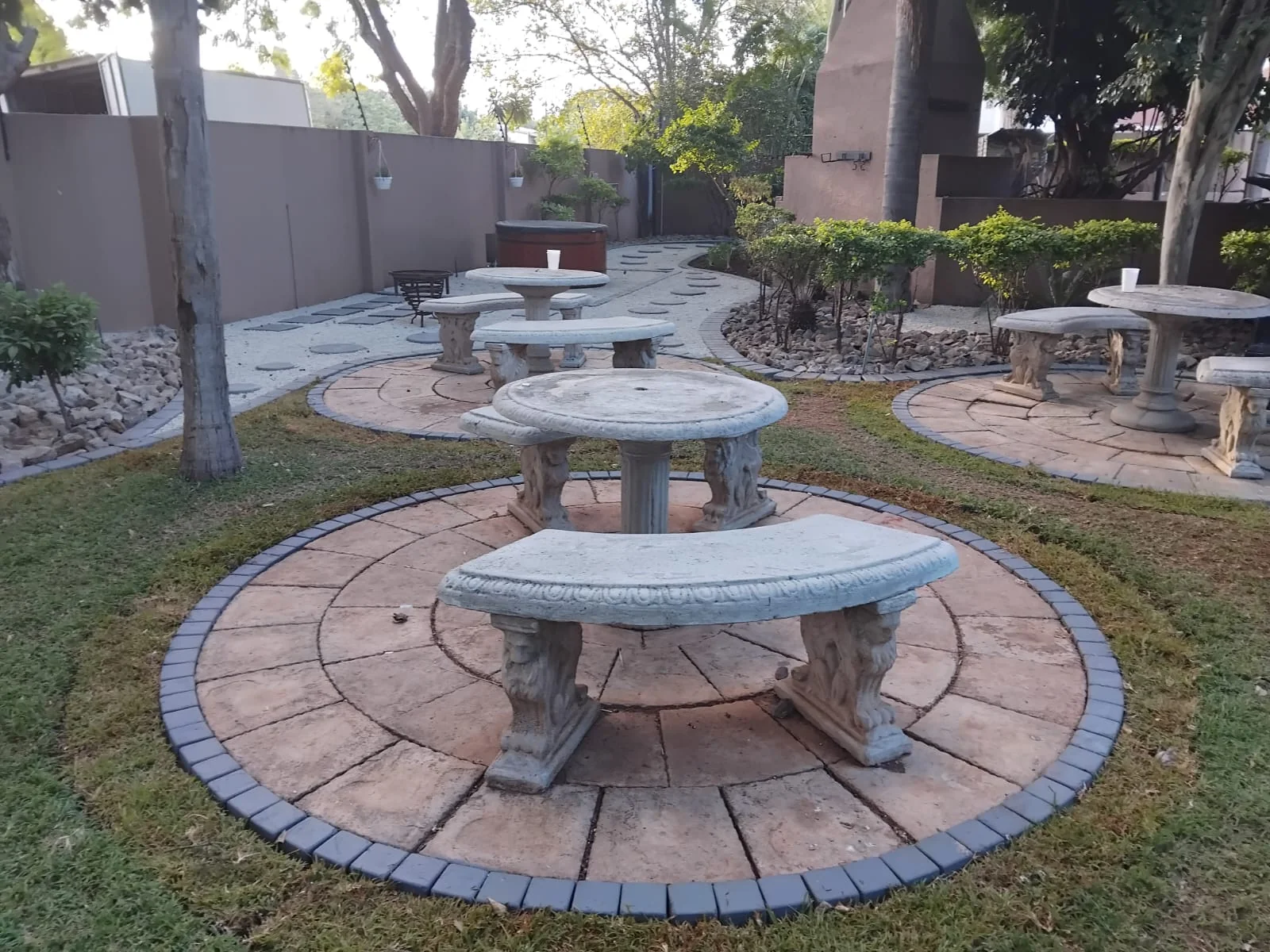 Backyard patio with paving and outdoor furniture